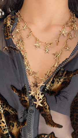 Collar estrella dorado efecto tres en uno