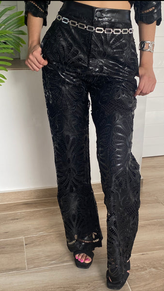 Conjunto negro troquelado de poli piel